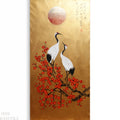 two white cranes standing on a branch with red flowers, against a golden background with a large red sun in the sky.