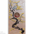 The image is a painting depicting a tree with yellow flowers and two birds perched on its branches. The tree has a large circular shape in the center, and there is Japanese text written in the top right corner of the painting.